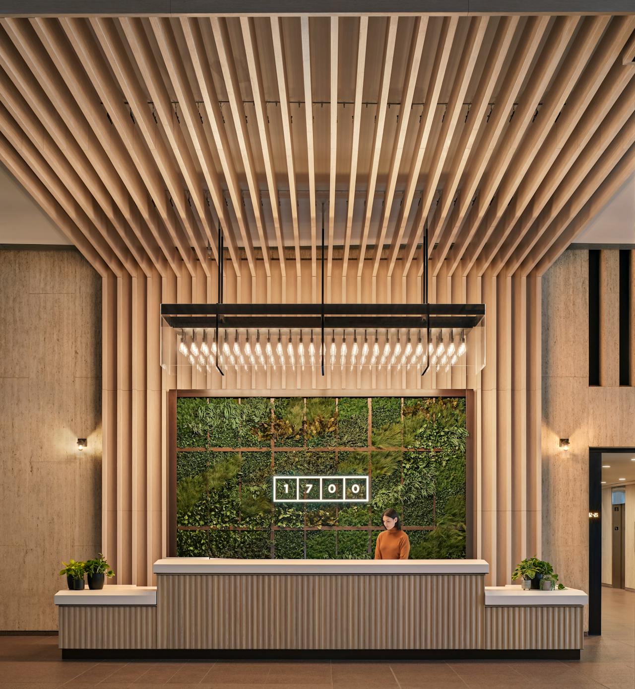 1700 lobby design with green elements & bronze detailing
