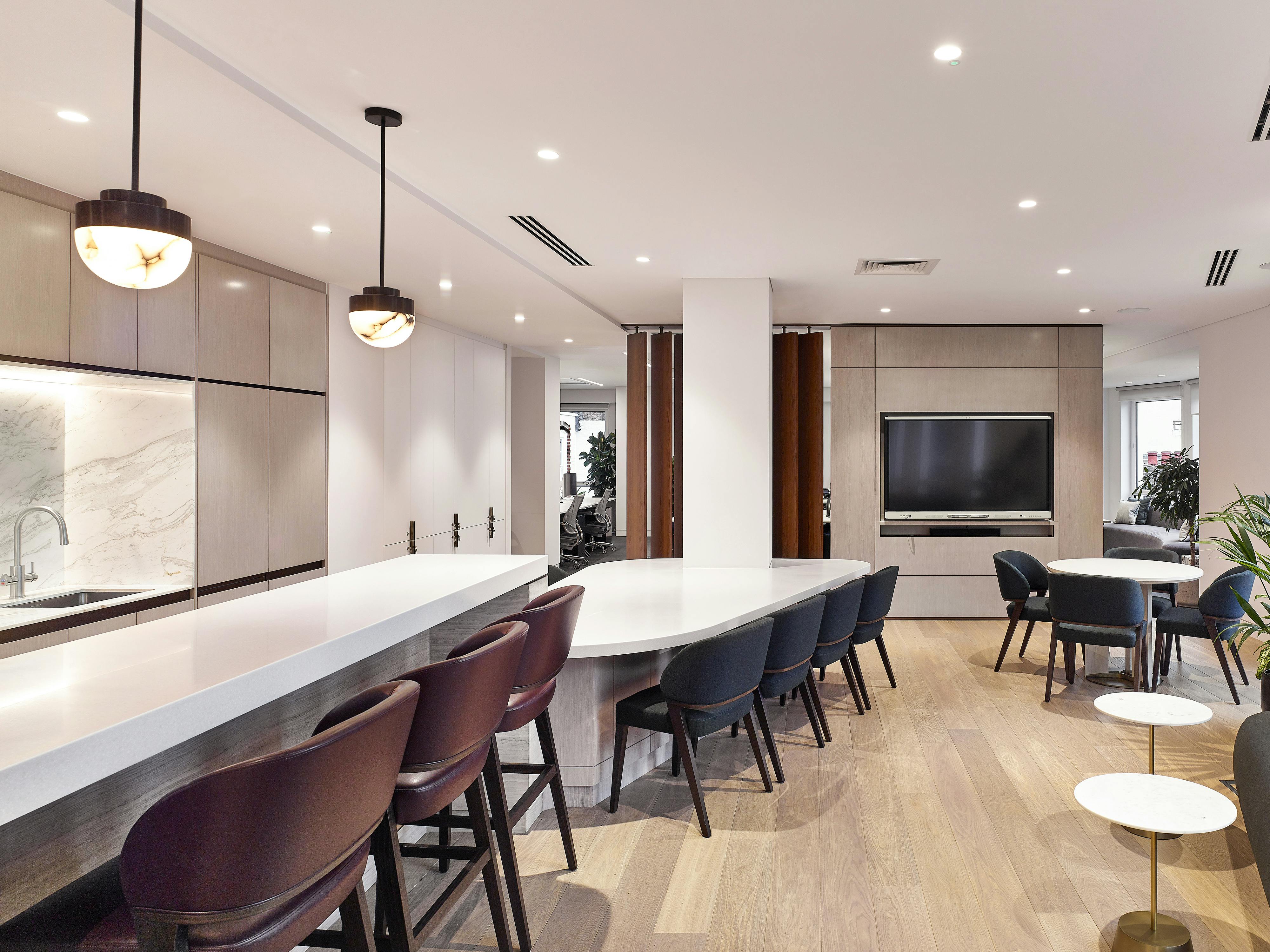 office desks in gathering kitchen bar area