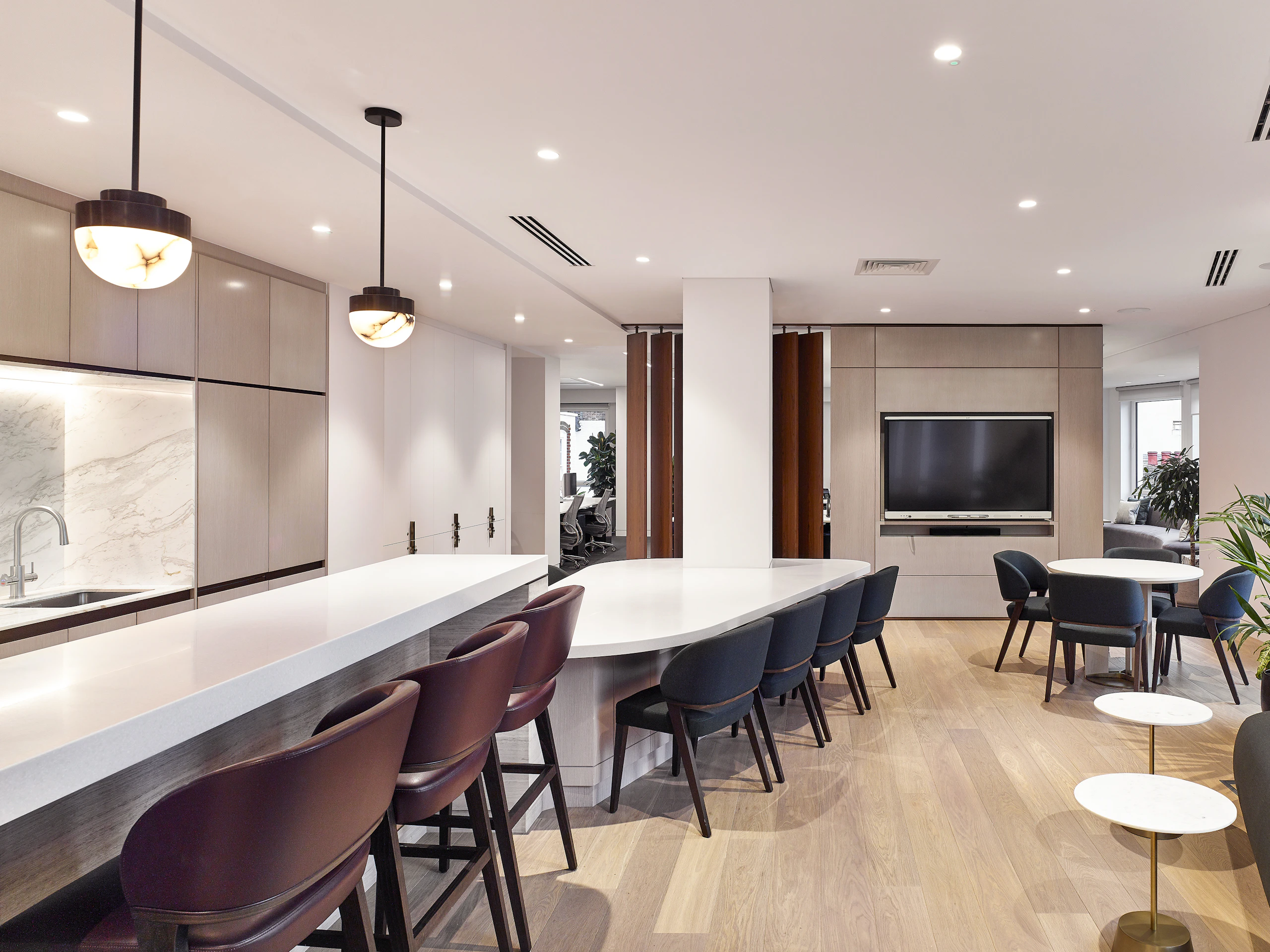 office desks in gathering kitchen bar area