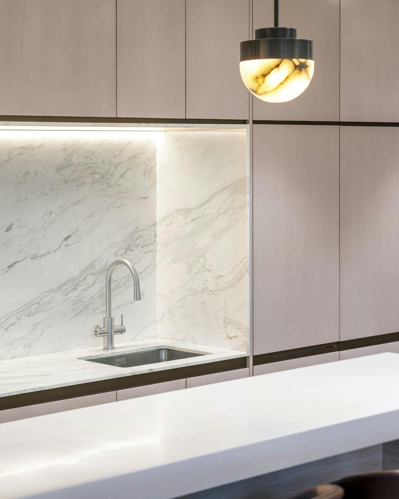 distinct office designed kitchen with sink