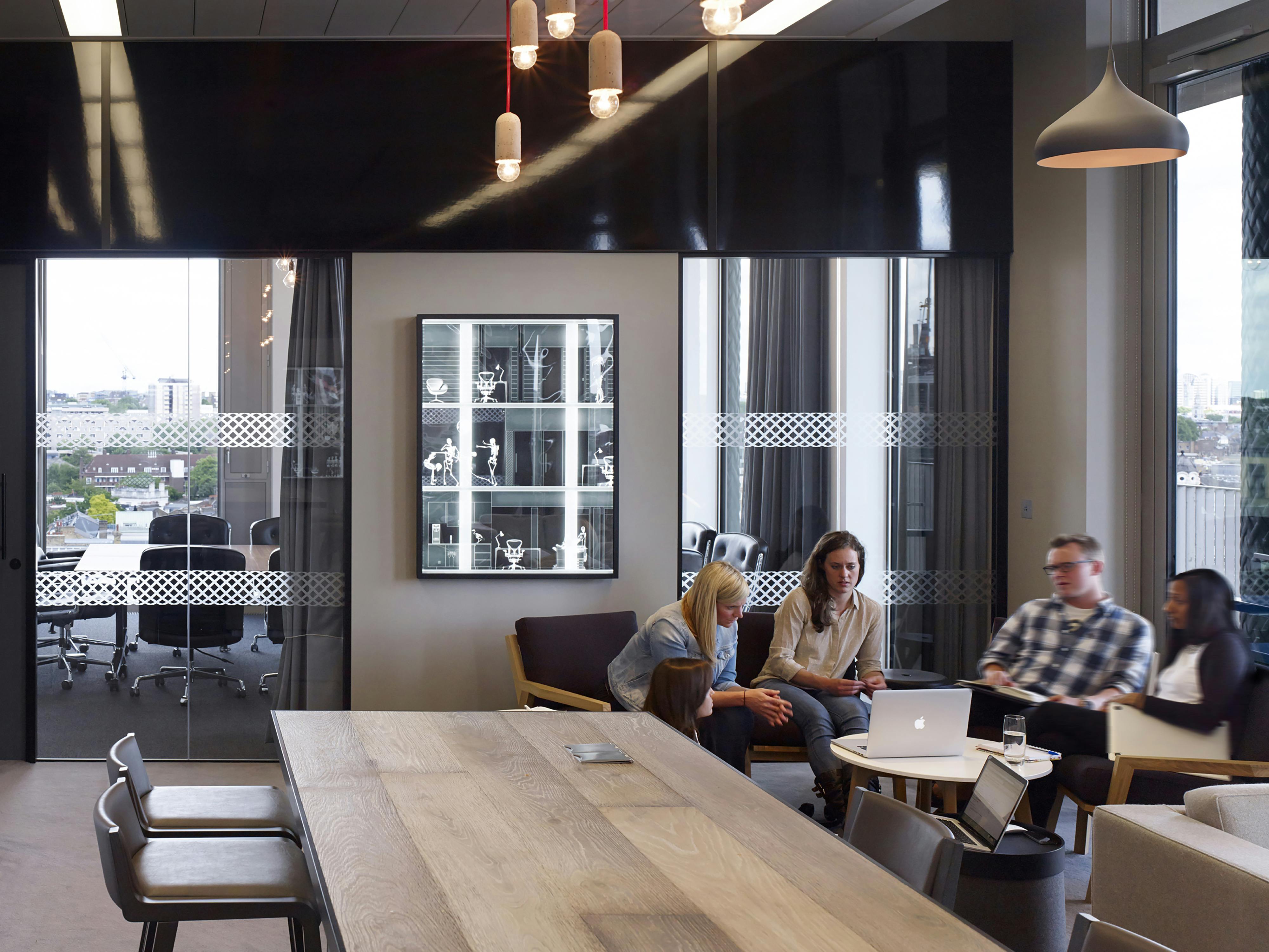 co-workers in a cheerful industrial designed meeting room
