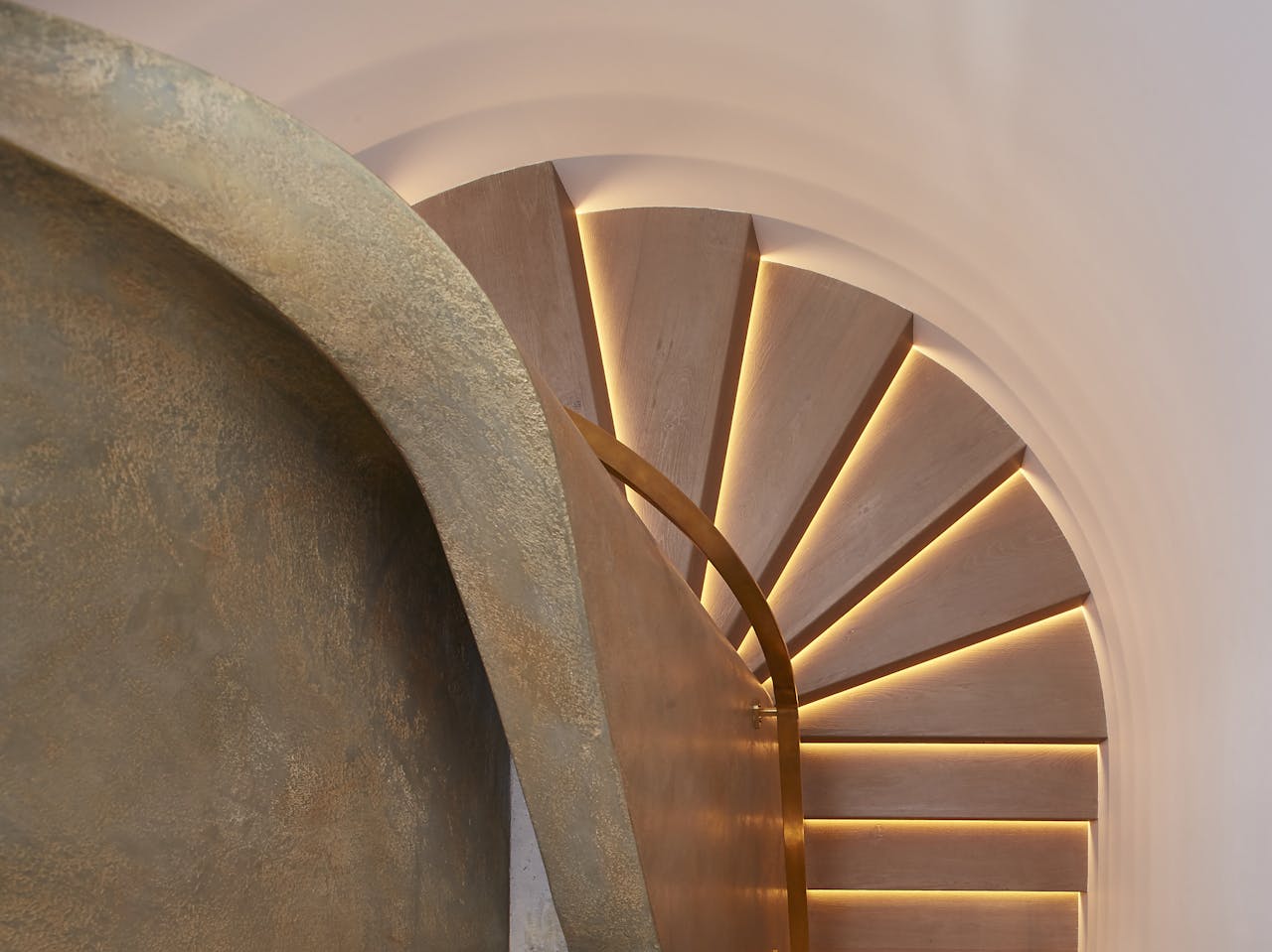 lighted staircase with metallic textured plaster