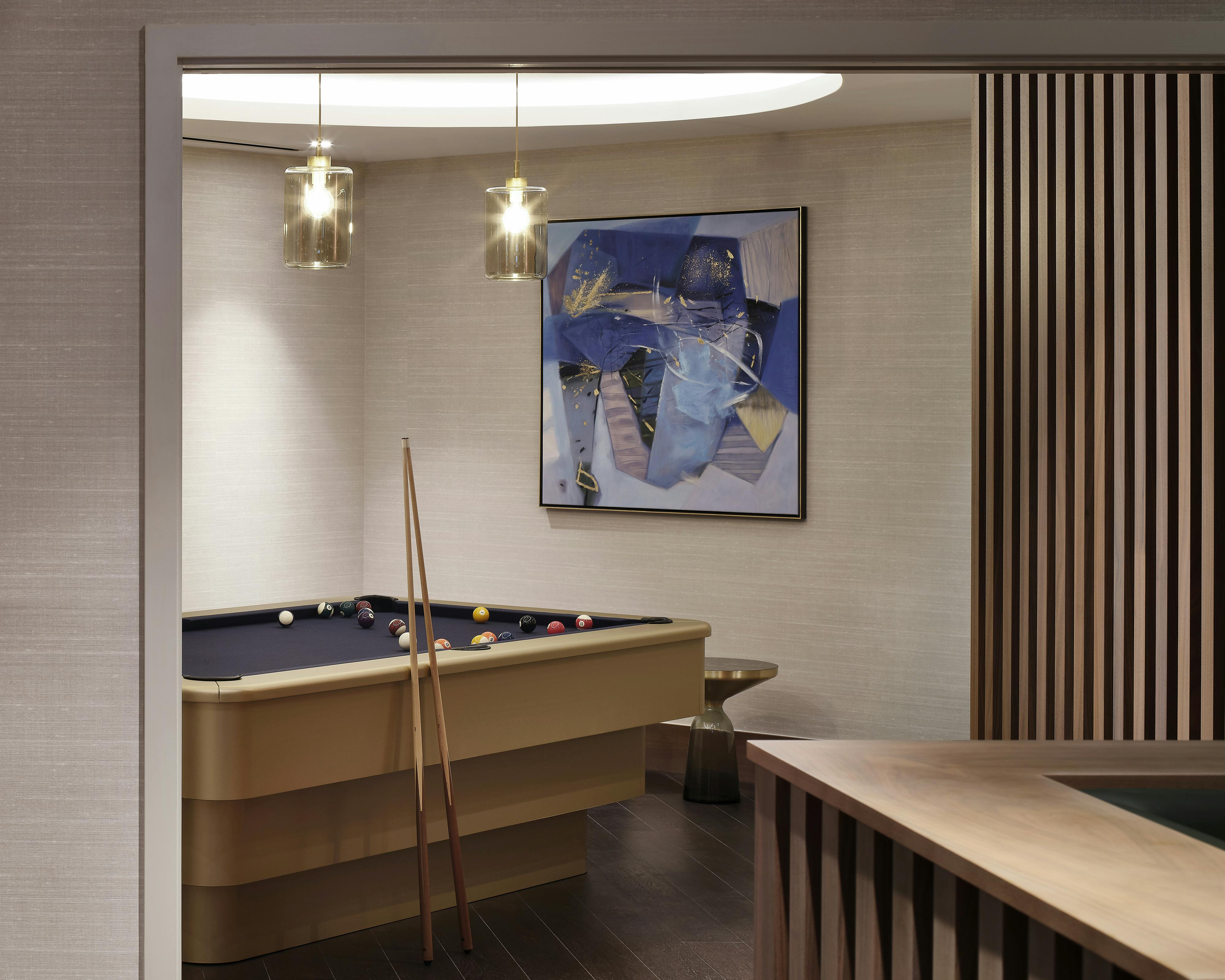 brass wrapped bespoke pool table in the games room