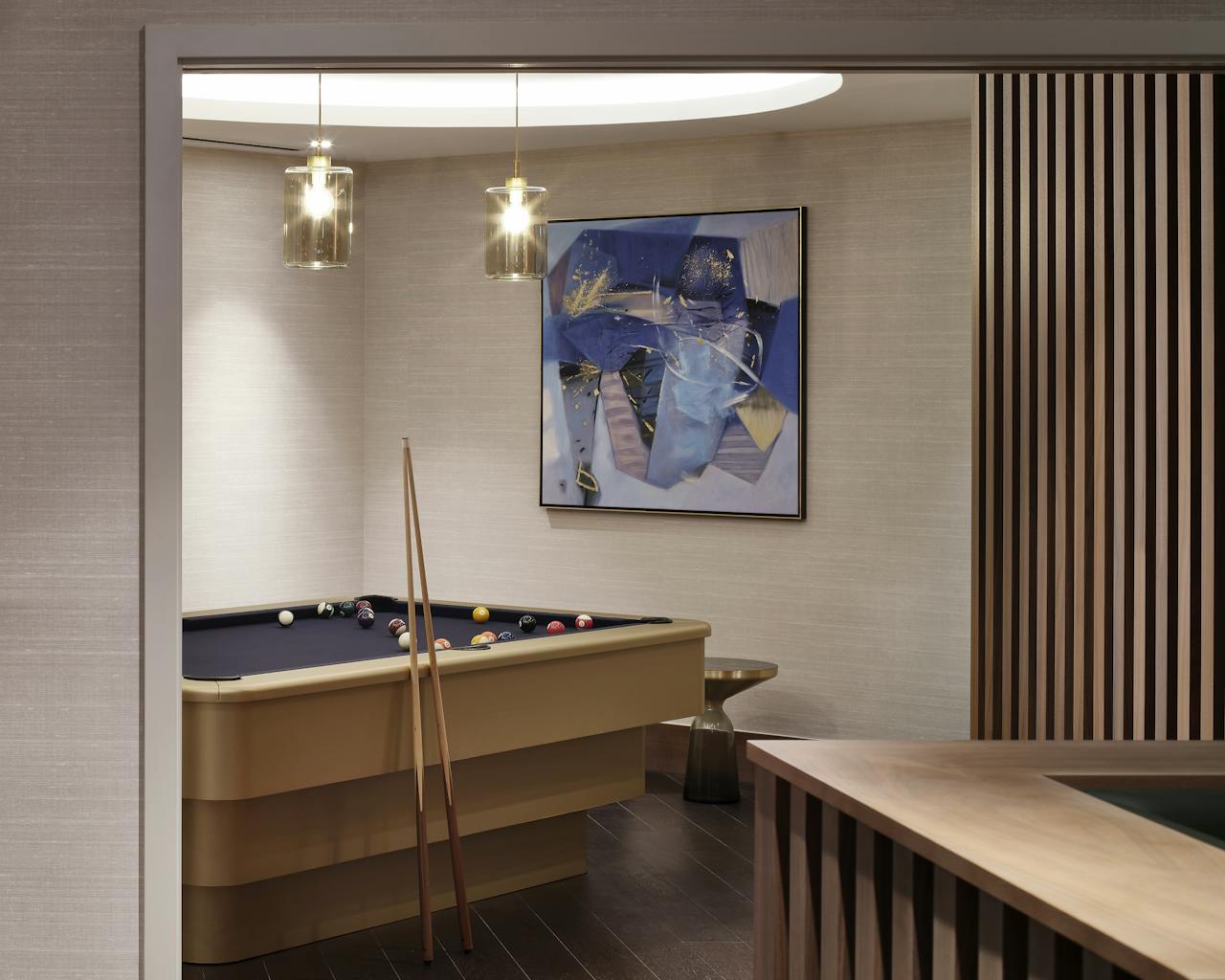 brass wrapped bespoke pool table in the games room