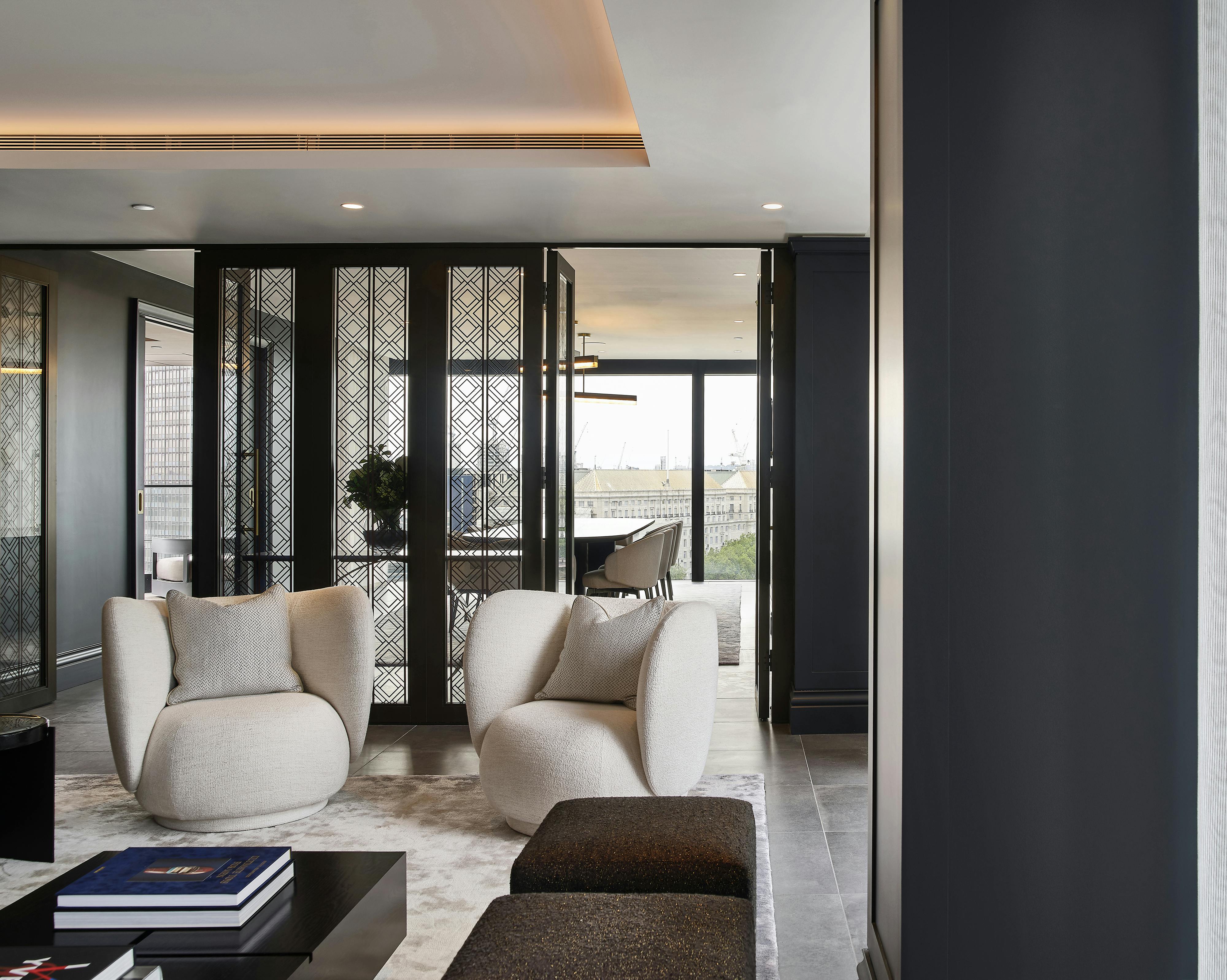 2 designer armchairs in lounge area
